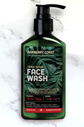 Triple-action Charcoal Face Wash Cleanser (Finca Vigia) in a green pump bottle on a marble background