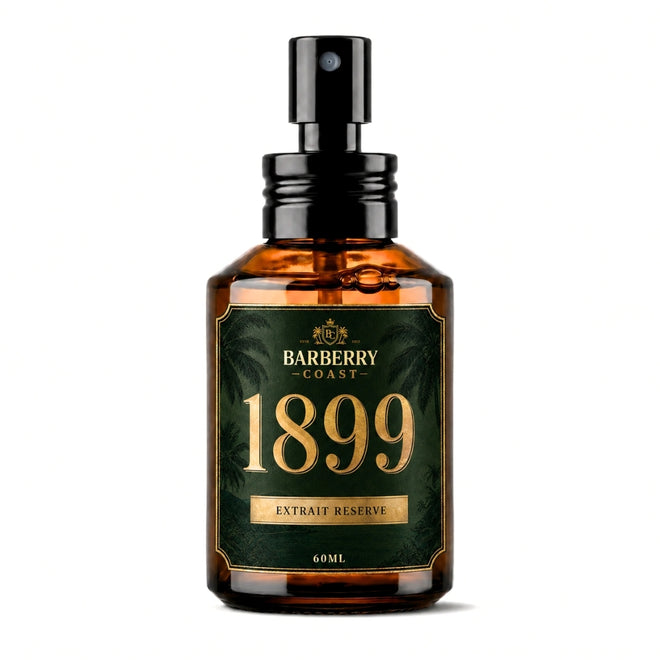 A 60ml amber glass spray bottle with a black pump dispenser, featuring a dark green and gold label for 'Barberry Coast 1899 Extrait Reserve'.