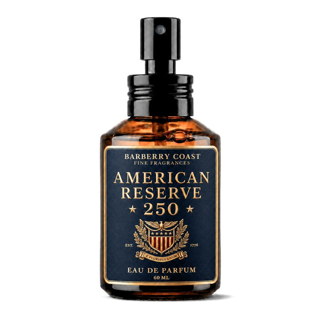 A 60 ml amber glass spray bottle of Barberry Coast American Reserve 250 Eau de Parfum, featuring a black pump and a navy blue label with gold lettering.