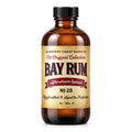 Amber bottle of Bay Rum aftershave splash with a yellow label on a white background. Barberry Coast