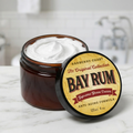 Jar of Bay Rum Supreme Shave Cream with a visible label on a marble surface