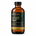 Barberry Coast Bay Rum Age Defense Tonic in a 4 oz amber bottle with a black cap, dark green palm-leaf label and gold accent band, on a white background.