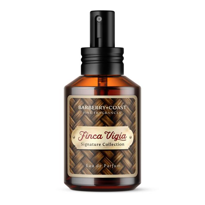 Finca Vigia Eau de Perfume Cologne bottle with new updated label design by Barberry Coast. Standard 2oz clear amber-colored apothecary bottle with a black atomizer sprayer cap. Inspired by Ernest Hemingway's -also known as Papa - home in Havana, Cuba.