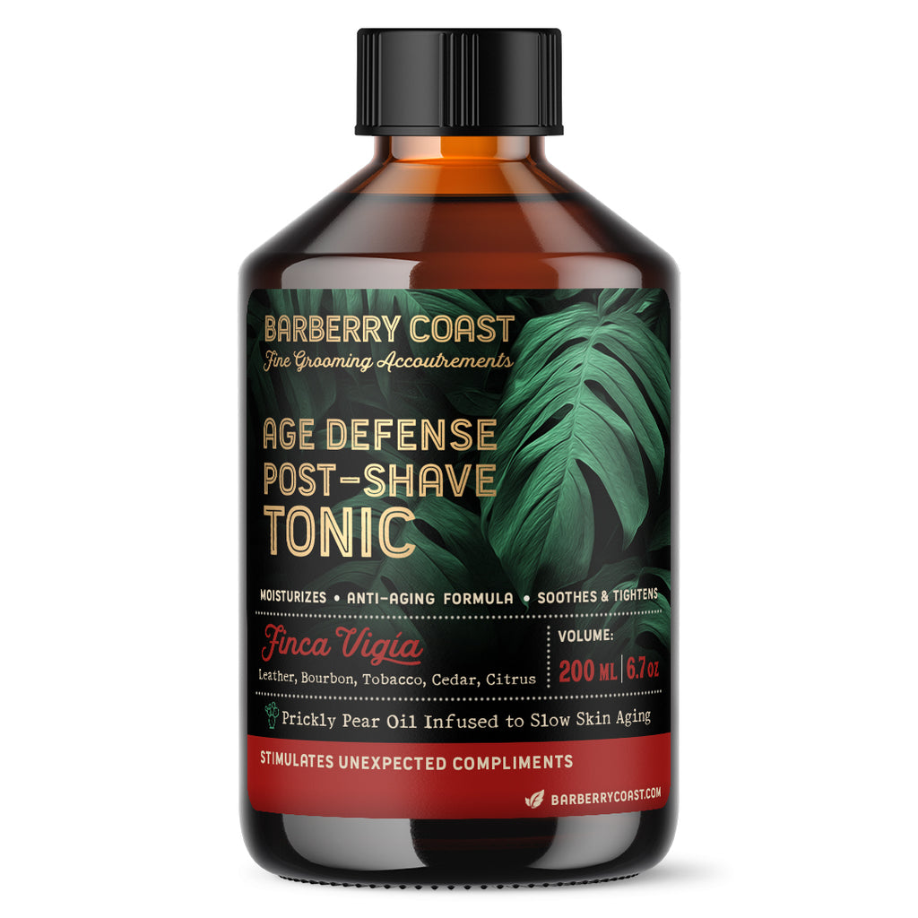 Age Defense Aftershave tonic bottle with a label featuring a green leafy design and the name 'Finca Vigía'. The cap is black, and the liquid inside is clear. Barberry Coast