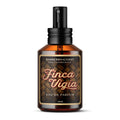 Finca Vigia Eau de Perfume Cologne bottle with new updated label design by Barberry Coast. Standard 2oz clear amber-colored apothecary bottle with a black atomizer sprayer cap. Inspired by Ernest Hemingway's -also known as Papa - home in Havana, Cuba.