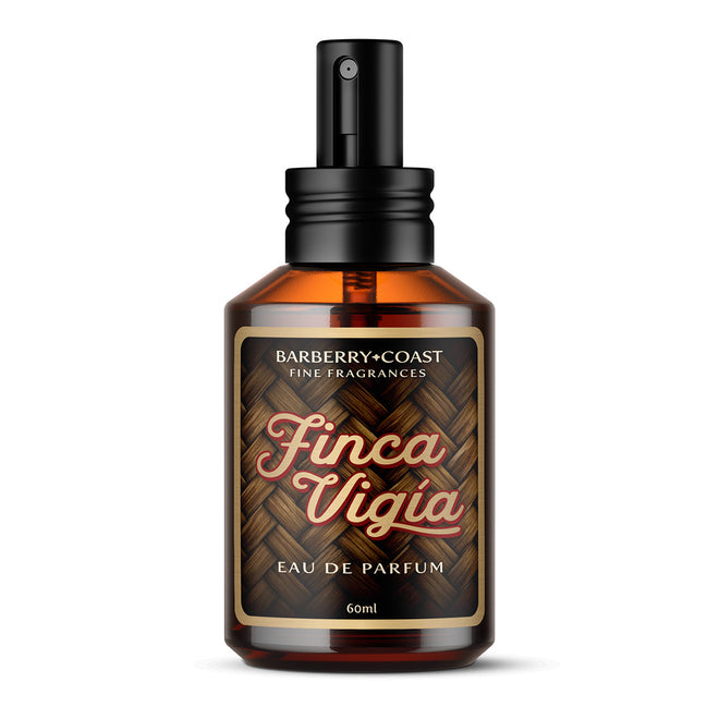 Finca Vigia Eau de Perfume Cologne bottle with new updated label design by Barberry Coast. Standard 2oz clear amber-colored apothecary bottle with a black atomizer sprayer cap. Inspired by Ernest Hemingway's -also known as Papa - home in Havana, Cuba.