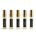 Five small fragrance bottles with gold caps on a white background. Barberry Coast Founder's Selection Fragrance Discovery Set.