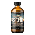 A clear amber glass bottle of Himalayan Ascent 2-In-1 Aftershave Lotion & Daily Moisturizer with a label featuring mountain imagery and the name of the product. Barberry Coast