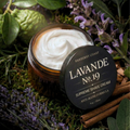 Jar of Barberry Coast Lavande No. 19 Supreme Shave Cream surrounded by lavender and cinnamon sticks on a natural background.