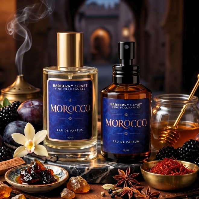 Two bottles of Barberry Coast Morocco Eau de Parfum on a decorative table with spices and fruits.