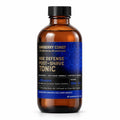 Barberry Coast Morocco Age Defense Tonic in a 4 oz amber bottle with a black cap, rich blue patterned label and gold lettering, on a white background.