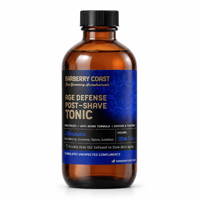 Barberry Coast Morocco Age Defense Tonic in a 4 oz amber bottle with a black cap, rich blue patterned label and gold lettering, on a white background.