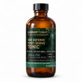 Barberry Coast Nature Isle Age Defense Tonic in an 8 oz amber Boston round bottle with a black cap, dark botanical label and green band, on a white background.