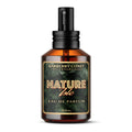 Nature Isle Eau de Parfum Cologne. Clear amber colored bottle with a black atomizer and cap. Label is green with monstera leaves and text "Nature Isle eau de parfum"
