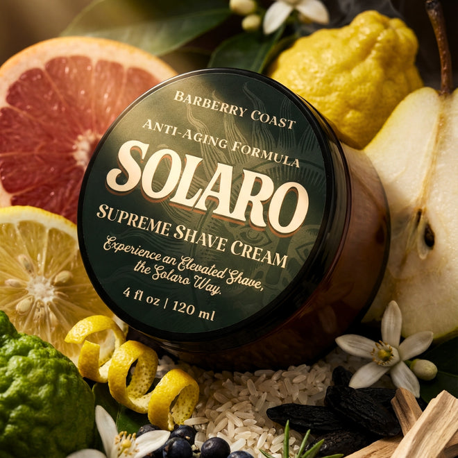 SOLARO Supreme Shave Cream jar surrounded by grapefruit, citron, silician bergamot, lemon zest, pear, neroli blossom, crisp green notes, juniper berries, pepperleaf, rice, tonka bean, mineral air, blond woods on a dark background