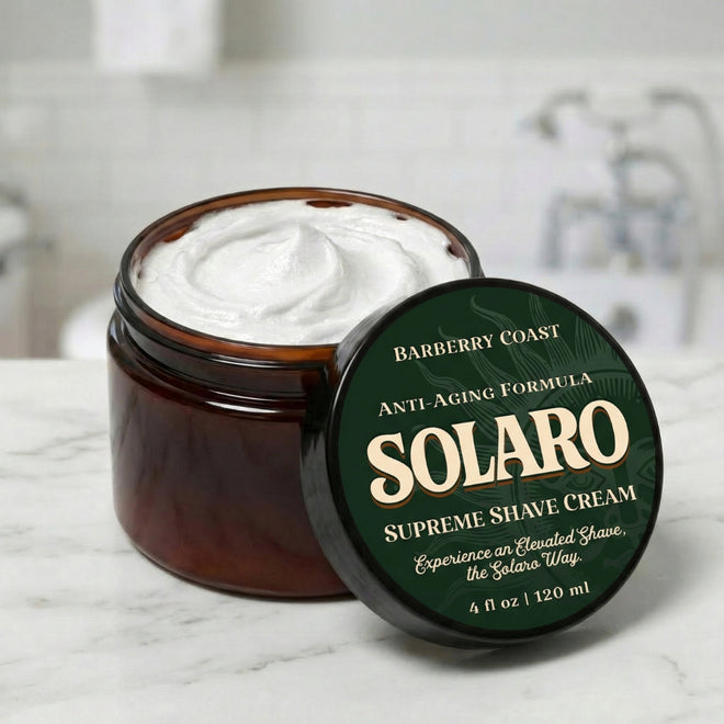 Jar of Solaro Supreme Shave Cream with green lid on a marble surface