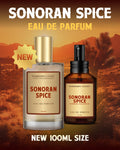 Two bottles of Sonoran Spice Eau de Parfum with a desert landscape background