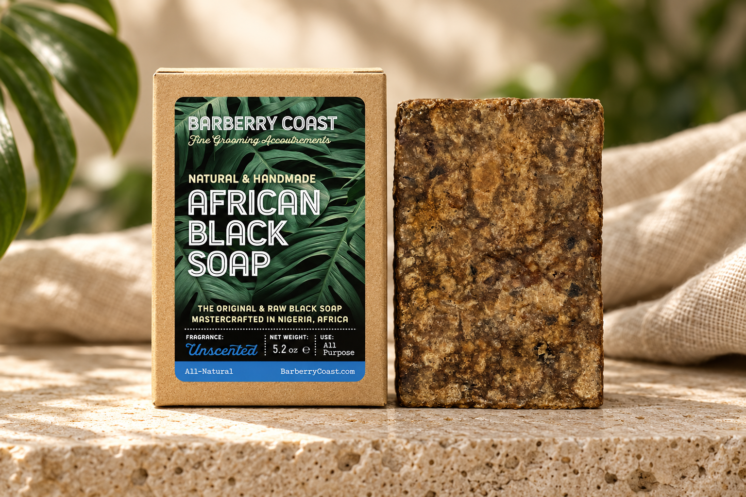 Barberry Coast African Black Soap beside its box, with the raw bar approximately the same size as the packaging.