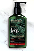 Triple-action Charcoal Face Wash Cleanser (Havana) in a green pump bottle on a marble background